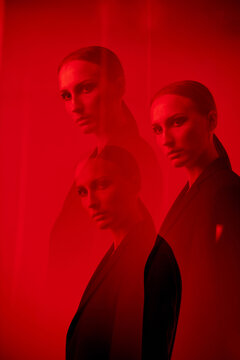 Multiple exposure fashion model standing red light