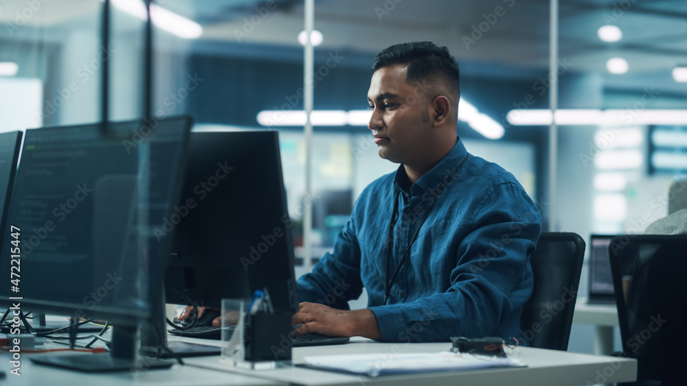 Poster In Diverse Office: Portrait of Handsome Indian Man Working on Desktop Computer. Focused Professional Creates Innovative Software, Modern App Design. Stylish Multi-Ethnic Authentic Workplace