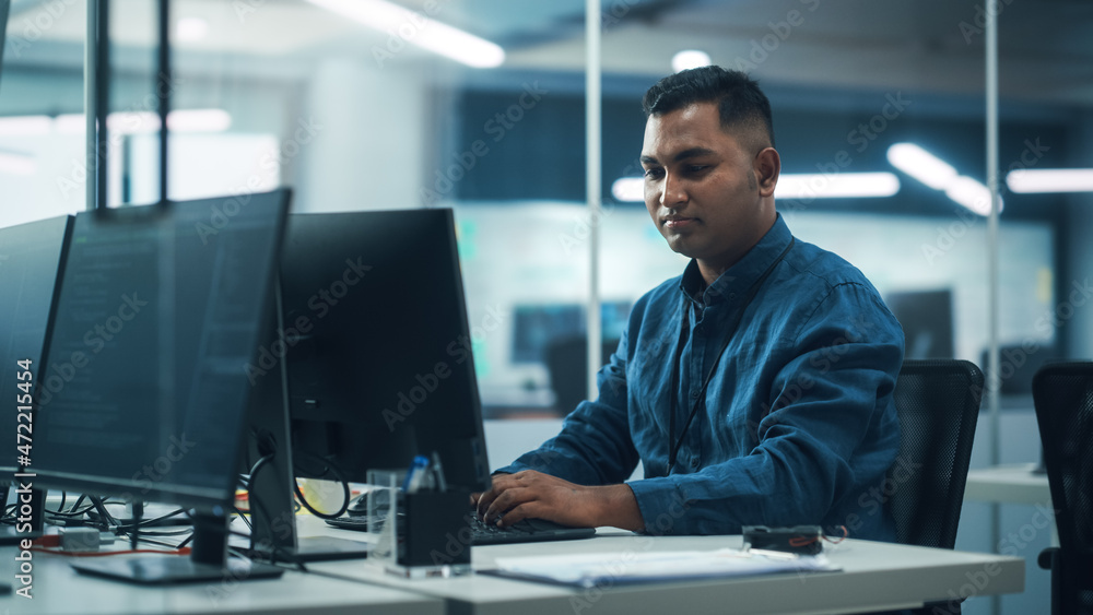 Poster In Diverse Office: Portrait of Handsome Indian Man Working on Desktop Computer. Professional Programmer Creates Innovative Software, Modern App Design. Stylish Multi-Ethnic Authentic Workplace