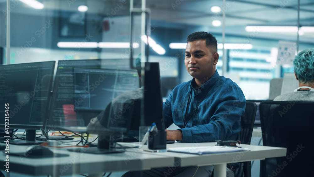 Poster In Diverse Office: Portrait of Handsome Indian Man Working on Desktop Computer. Professional Programmer Creates Innovative Software, Modern App Design. Stylish Multi-Ethnic Authentic Workplace
