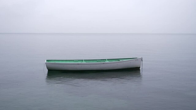 A small boat isolated on the Leman lake. October 2021, Switzerland.