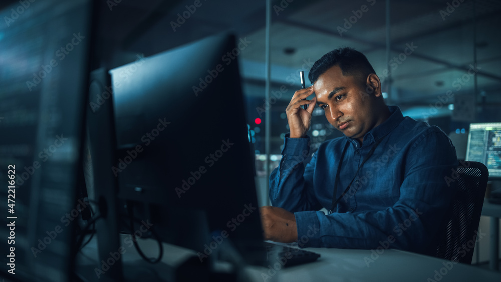 Aufkleber Night Office: Portrait of Handsome Indian Man in Working on Desktop Computer. Digital Entrepreneur Typing, Creating Software, e-Commerce App Design, Programming. Thoughtful Man Seeking Solution