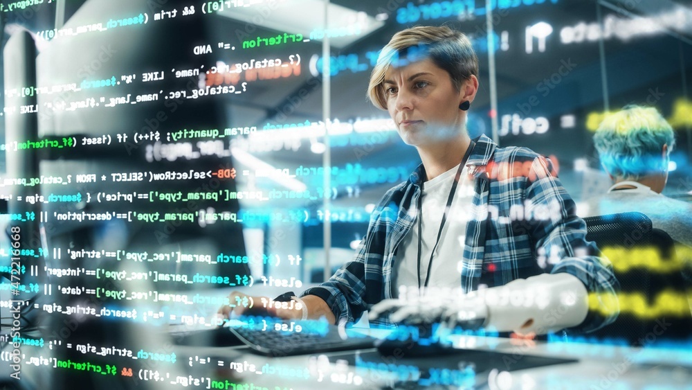 Poster Shot with Visualisation of Running Computer Code on Foreground. Portrait of Motivated Woman with Disability Using Prosthetic Arm to Work on Computer in Body Positive Office. Myoelectric Bionic Hand