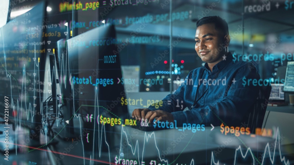 Poster Concept Shot with Visualisation of Running Computer Code on Foreground. Portrait of Handsome Indian Man in Working on Computer at Night in Office. Digital Entrepreneur Creating Modern Software.