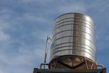 The image of the water tank of a building placed on a high ground to allow water to flow freely.