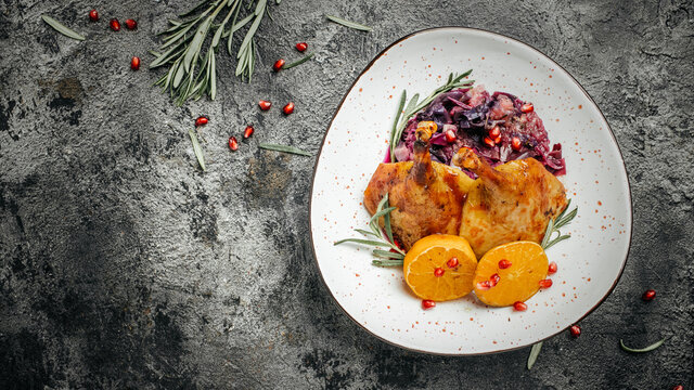 Portion of roast duck leg red cabbage homemade. banner, menu, recipe place for text, top view