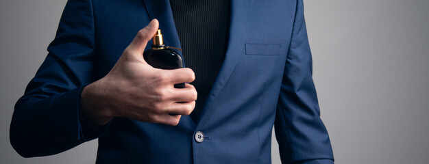 young business man using perfume