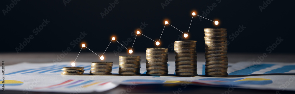 Poster stacks of coins with graph paper.