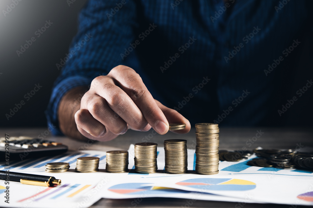Poster man stacking coins with calculator