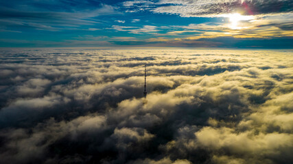 Fototapeta na wymiar Aerial view of the television tower in the fog