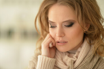 Close up view of sad young woman posing