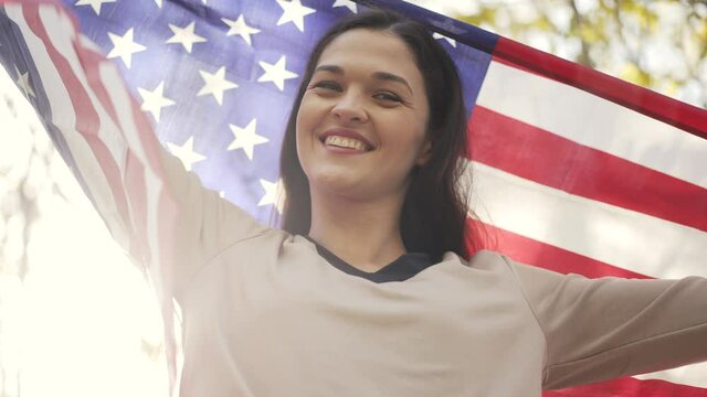 Happy woman with flag of USA