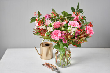 Finished flower arrangement in a vase for home. Flowers bunch, set for interior. Fresh cut flowers...