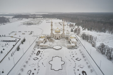 Scenic aerial view of The White Mosque - architectural pearl of ancient russian town Bolgar in Tatarstan republic in Russian Federation. Beautiful winter look of muslim temple in old touristic city