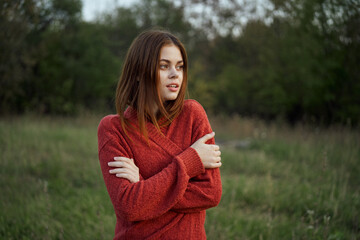 woman red sweater cool air nature romance