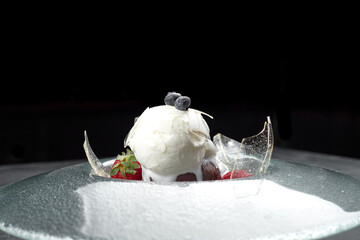 Dessert chocolate fondant with ice cream and strawberries