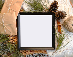 Fototapeta na wymiar Christmas decorations and empty frame on table, background, mockup