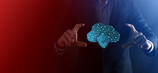 Cloud technology. Polygonal wireframe cloud storage sign with shield with a tick on dark blue....