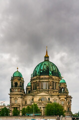 Fototapeta na wymiar The Berlin Cathedral (Berliner Dom), also known as, the Evangelical Supreme Parish and Collegiate Church, a monumental German Evangelical church and dynastic tomb on the Museum Island on a cloudy day.