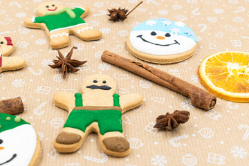 Fototapeta na wymiar Gingerbread cookies on brown background