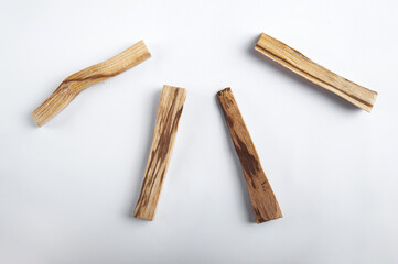 Palo Santo bars close-up and copy space. Ritual cleansing with sacred ibiocai, meditation, aromatherapy with incense and candles..