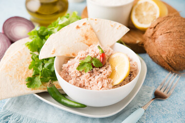 Mas Huni. Traditional Maldivian breakfast of tuna, coconut, onion and chili with chapati tortillas.