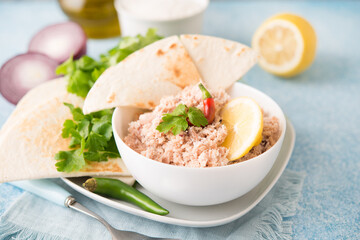 Mas Huni. Traditional Maldivian breakfast of tuna, coconut, onion and chili with chapati tortillas.