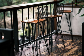 Tall table - Wooden table steel legs simplistic, tall bar stools in stylish kitchen with wooden cupboards.