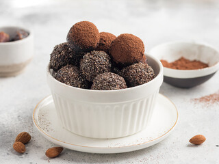 Chia seeds cacao energy balls on gray background. Healthy vegan raw dessert. closeup