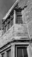 Obraz premium English medievil Castle with leaded windows in monochrome 