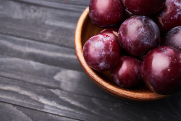 plums fruits natural products on a wooden table top view