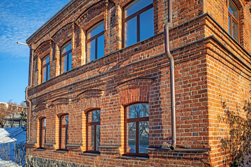 Historic red brick building on a sunny winter day