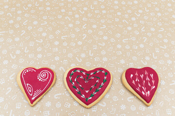 Heart shaped gingerbread cookies on brown background