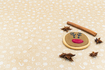 Fototapeta na wymiar Gingerbread cookie on brown background
