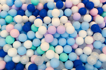 Multi-colored balls in the pool top view