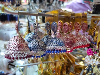 30 Nov 2021, Indian Traditional earrings is displayed in a street shop for sale in Pune,...