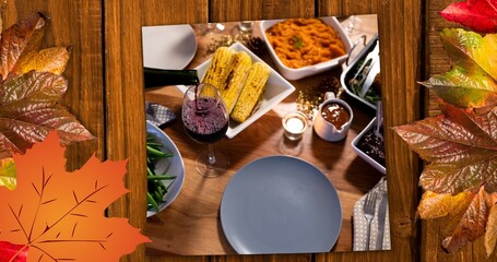 Composite image of various delicious food at thanksgiving party and autumn leaves, copy space