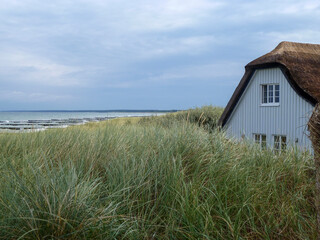 Thatched roof house on the Baltic Sea beach