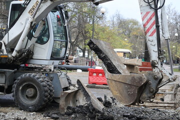 excavator digging a trench
