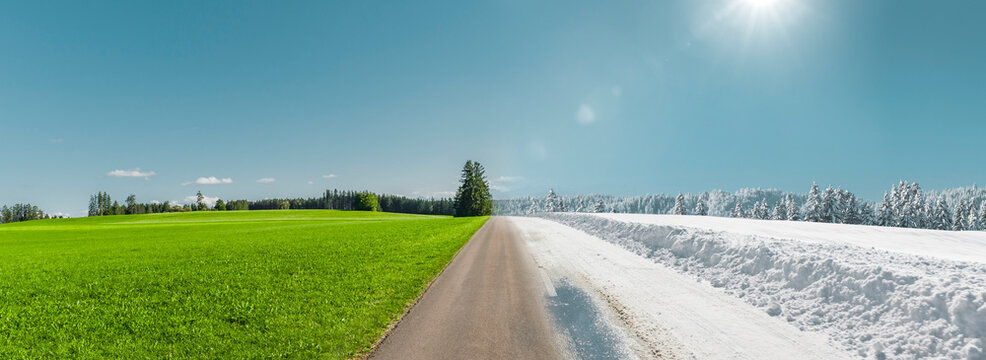 Jahreszeitenwechsel von Sommer- zu Winter-fahrbahn auf einer Landstrasse