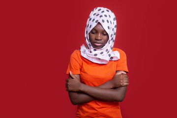 sad african woman wearing muslim headscarf 