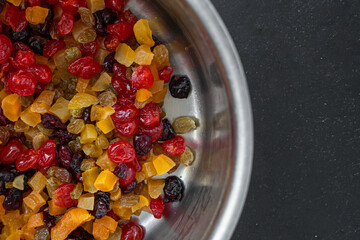 Stollen and muffin filling. Mix of dried berries and fruits. Candied yellow and red fruits. Appetizing picture for kitchen and restaurant. Christmas food. Juicy colors of food.