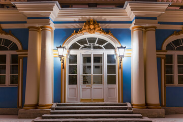 Palace door illuminated at night