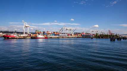 Seattle, Washington, USA - June 4 2021: Cargo container ship and Seattle Logistics shipping...
