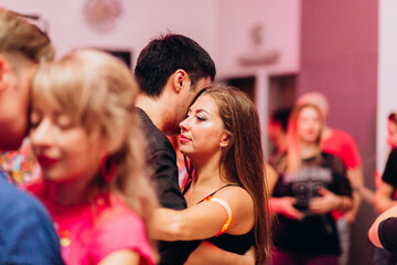 People dancing bachata on the dance floor
