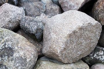 Rockfall on the road in the mountains. Stones of different sizes. Landslides.