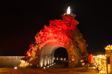 Biarritz Virgin Rock with red lightings. Christmas celebration 2021. Basque Country of France. - obrazy, fototapety, plakaty