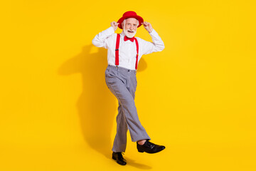 Full size photo of funny old man dance wear red cap tie shirt suspenders pants shoes isolated on...