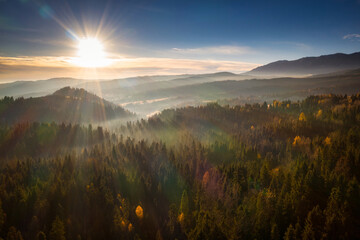 A beautiful sunrise over the Tatra Mountains . The pass over Lapszanka in Poland.