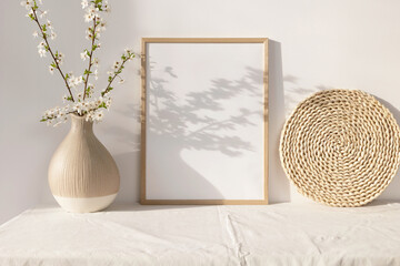 Wooden photo frame mockup with beige vase 